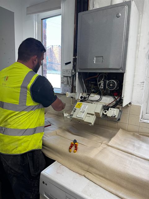 GO2 Plumbing and Heating engineer working on a boiler installation