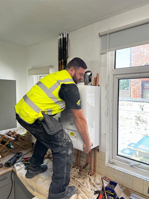 GO2 engineer carrying out heating and boiler work on site