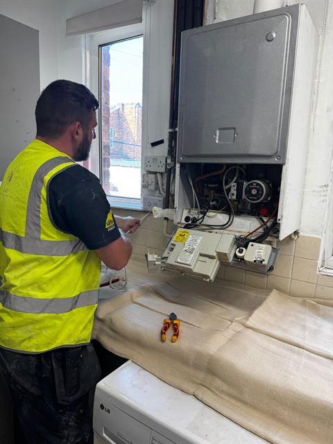 GO2 Plumbing and Heating engineer working on a boiler installation