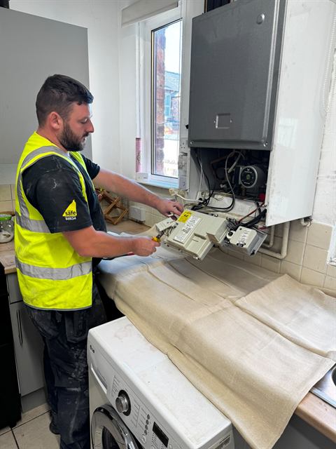 GO2 engineer carrying out heating and boiler work on site