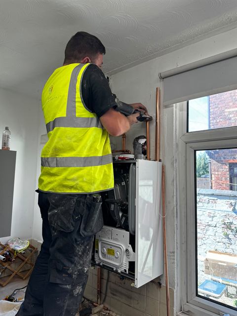 GO2 Plumbing and Heating engineer working on a boiler installation