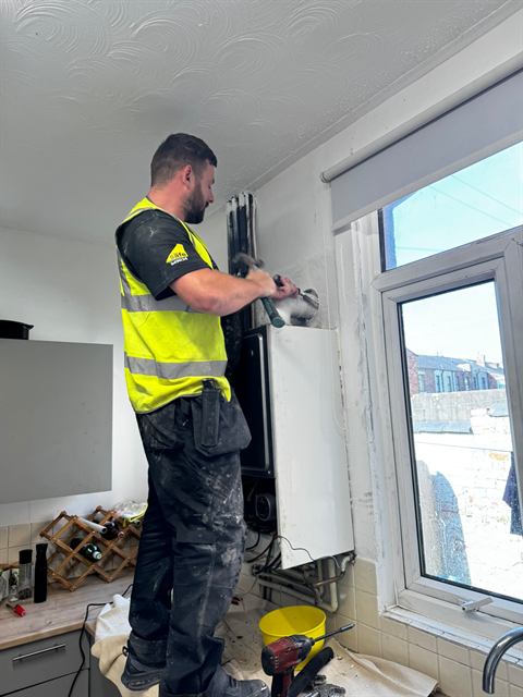 GO2 engineer carrying out heating and boiler work on site