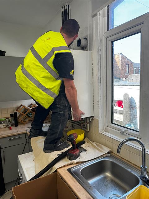 GO2 Plumbing and Heating engineer working on a boiler installation
