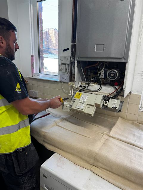 GO2 engineer carrying out heating and boiler work on site