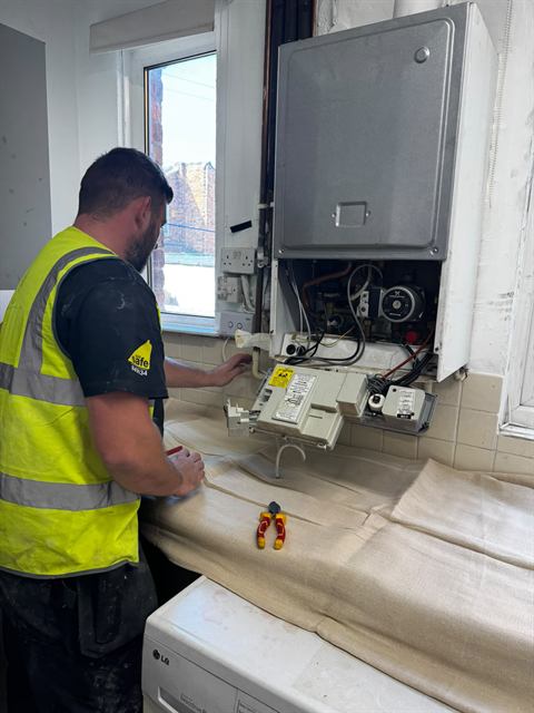 GO2 Plumbing and Heating engineer working on a boiler installation