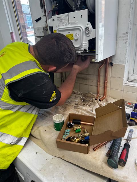 GO2 engineer carrying out heating and boiler work on site